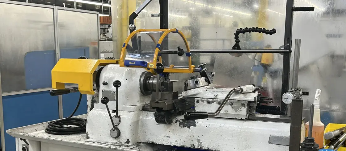 Hardinge lathe fitted with a yellow chuck guard and clear safety shield